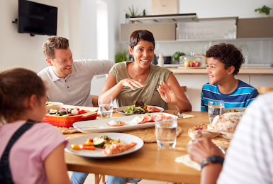 Quote Family Breakfast is being eaten by multigenerational mixed race family